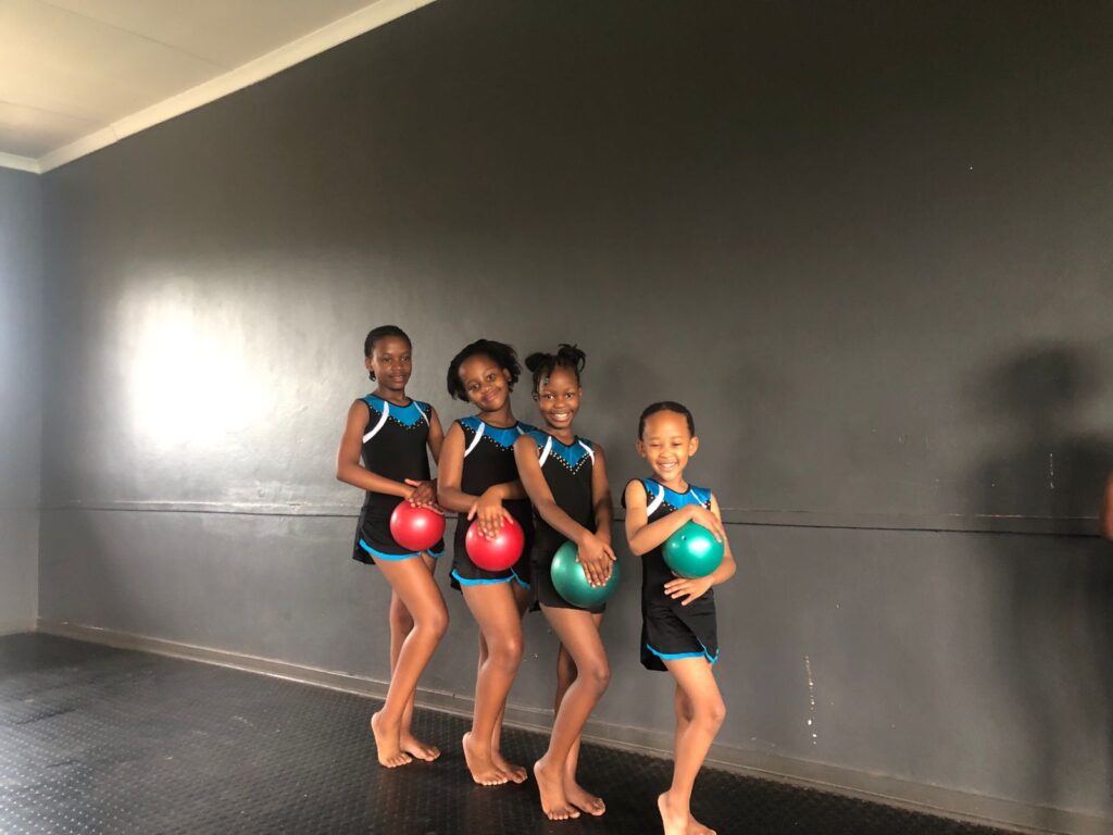 Emerald Gymnastics, gymnasts holding a ball